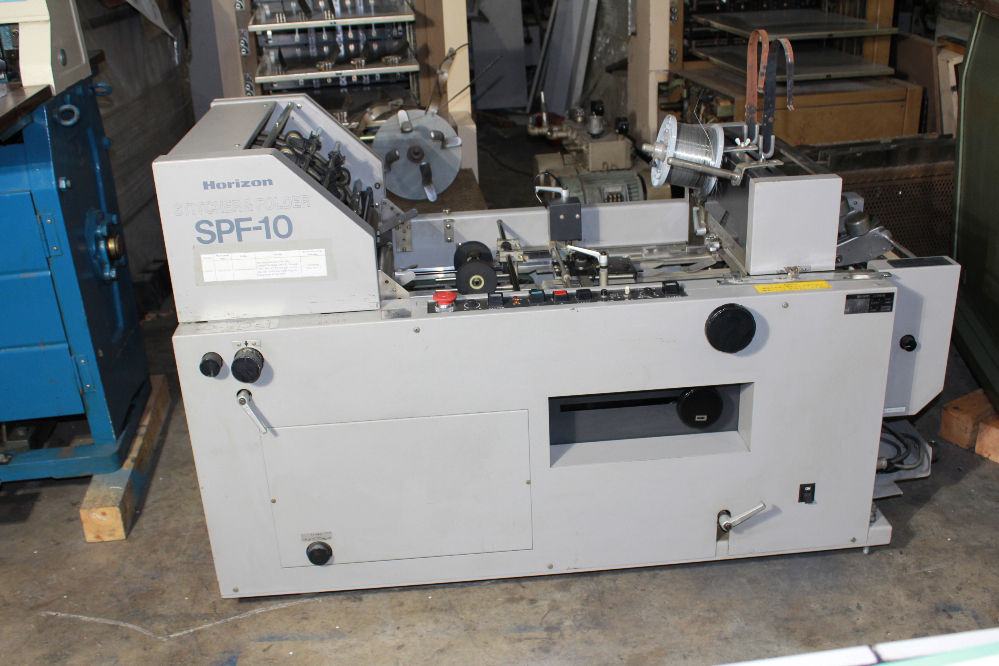 Máy đóng ghim sách 2 đầu TP210